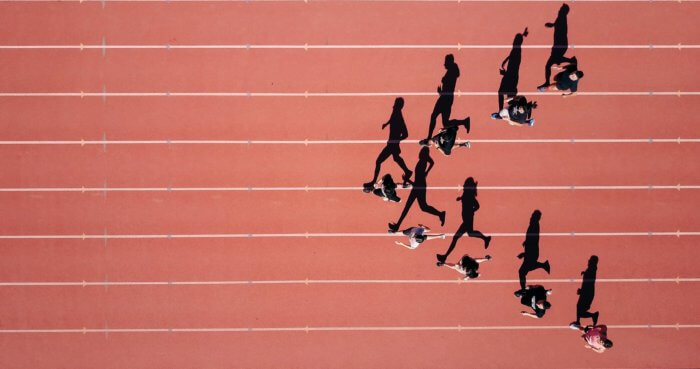 Racers running on an outdoor track